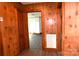 Wood paneled hallway featuring views into other rooms and an air conditioning vent at 1433 Buffalo Shoals Rd, Catawba, NC 28609