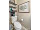 This powder room features decorative shelving and a unique design, blending functionality with a touch of elegance at 14622 Greenpoint Ln, Huntersville, NC 28078