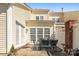 Back patio featuring a table and chairs, with an area rug, and privacy fence at 14622 Greenpoint Ln, Huntersville, NC 28078