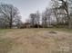 Large backyard with bare trees and a shed at 1525 Oakridge Dr, Salisbury, NC 28146