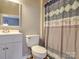 Neutral bathroom showcasing a vanity, toilet, and patterned shower curtain with elephant pattern at 1525 Oakridge Dr, Salisbury, NC 28146