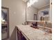 Bathroom vanity with large mirror and makeup counter with granite countertop at 1525 Oakridge Dr, Salisbury, NC 28146