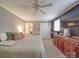 Relax in this main bedroom with carpet, ceiling fan, natural light and access to the en suite at 1525 Oakridge Dr, Salisbury, NC 28146