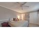 Relax in this main bedroom with carpet, ceiling fan, natural light and access to the en suite at 1525 Oakridge Dr, Salisbury, NC 28146