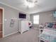 This bedroom offers carpeted flooring, ceiling fan, and plenty of space for a bedroom at 1525 Oakridge Dr, Salisbury, NC 28146