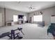 Spacious bonus room featuring a ceiling fan, multiple windows, and ample lighting at 1525 Oakridge Dr, Salisbury, NC 28146
