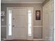 Welcoming foyer featuring neutral paint, white trim and a decorative front door with sidelights at 1525 Oakridge Dr, Salisbury, NC 28146