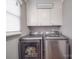 Modern laundry room featuring side-by-side washer and dryer units at 1525 Oakridge Dr, Salisbury, NC 28146