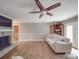 Bright living room featuring a brick fireplace, hardwood floors, and neutral paint scheme at 1525 Oakridge Dr, Salisbury, NC 28146