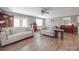 Cozy living room with wood-look floors, neutral walls, and comfortable seating arrangement at 1525 Oakridge Dr, Salisbury, NC 28146