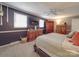 Spacious main bedroom with carpet, ceiling fan, TV and wooden furniture at 1525 Oakridge Dr, Salisbury, NC 28146