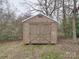 Small wooden shed with double doors in the backyard at 1525 Oakridge Dr, Salisbury, NC 28146