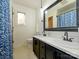 Bright bathroom featuring double sinks, modern fixtures, and stylish tile flooring at 1590 Daybreak Ridge Rd, Kannapolis, NC 28081