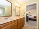 Bathroom featuring a double vanity with a view to the main bedroom at 1590 Daybreak Ridge Rd, Kannapolis, NC 28081