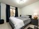 Modern bedroom with a comfortable bed, contemporary decor, and natural light from the window at 1590 Daybreak Ridge Rd, Kannapolis, NC 28081