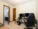 Bedroom showing a desk with two monitors, an office chair, and a carpeted floor at 1590 Daybreak Ridge Rd, Kannapolis, NC 28081