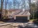 Charming two-story home featuring an attached garage and a neutral color palette surrounded by lovely trees at 1590 Daybreak Ridge Rd, Kannapolis, NC 28081