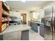 Functional kitchen with stainless steel appliances, gray cabinetry, and ample counter space at 1590 Daybreak Ridge Rd, Kannapolis, NC 28081