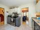 Efficient kitchen layout with stainless steel appliances, gray cabinets, and direct access to the dining area at 1590 Daybreak Ridge Rd, Kannapolis, NC 28081