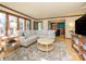Inviting living room featuring large windows, comfortable seating, and a cozy atmosphere at 1590 Daybreak Ridge Rd, Kannapolis, NC 28081