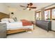 Cozy bedroom featuring a ceiling fan, a window, and a dresser at 1590 Daybreak Ridge Rd, Kannapolis, NC 28081