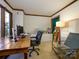 Bright and spacious office with natural light, featuring a wooden desk and comfortable seating at 1590 Daybreak Ridge Rd, Kannapolis, NC 28081
