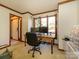 Serene office with a large window, wooden desk, and stylish decor creating a productive workspace at 1590 Daybreak Ridge Rd, Kannapolis, NC 28081