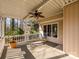 Enjoy the covered back porch with views of the wooded backyard at 1590 Daybreak Ridge Rd, Kannapolis, NC 28081