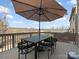 Spacious back deck with dining set and umbrella, perfect for enjoying outdoor meals and relaxation at 1630 Sassafras Ct, Fort Mill, SC 29715