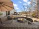 Backyard featuring a fire pit, lounge area, and ample space for outdoor activities at 1630 Sassafras Ct, Fort Mill, SC 29715