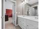 Bright bathroom with a double sink vanity, white cabinets, and a large mirror at 1630 Sassafras Ct, Fort Mill, SC 29715