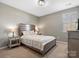 Cozy bedroom with neutral tones, large bed, and side tables with lamps for a relaxing ambiance at 1630 Sassafras Ct, Fort Mill, SC 29715