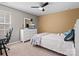 Bedroom with a window, a white dresser with a TV, and neutral-colored walls at 1630 Sassafras Ct, Fort Mill, SC 29715