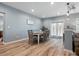 Dining room with hardwood floors, a dining table, and doors leading to the backyard at 1630 Sassafras Ct, Fort Mill, SC 29715