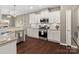 Well-appointed kitchen featuring white cabinets, stainless steel appliances, and granite countertops at 1630 Sassafras Ct, Fort Mill, SC 29715