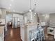 Spacious kitchen featuring a center island with seating, stainless steel appliances, and granite countertops at 1630 Sassafras Ct, Fort Mill, SC 29715