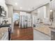 Bright kitchen with stainless steel appliances, white cabinets, and granite countertops at 1630 Sassafras Ct, Fort Mill, SC 29715