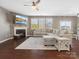 Inviting living room features a fireplace, large sectional sofa, and an abundance of natural light at 1630 Sassafras Ct, Fort Mill, SC 29715