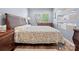 Comfortable main bedroom featuring a large bed, wooden furniture, and natural light at 1630 Sassafras Ct, Fort Mill, SC 29715