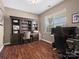 Office features wood floors, built-in shelving, and a bright window at 1630 Sassafras Ct, Fort Mill, SC 29715