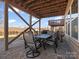 Cozy outdoor patio with a table and chairs, perfect for entertaining and dining at 1630 Sassafras Ct, Fort Mill, SC 29715