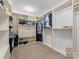 Spacious walk-in closet with custom shelving and carpeted floors providing ample storage at 1630 Sassafras Ct, Fort Mill, SC 29715