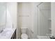 Well-lit bathroom featuring a single vanity, toilet, and a shower-tub combination at 203 Makayla Ct, Fort Mill, SC 29715