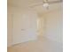 Bright bedroom with ample closet space, featuring neutral carpeting and a ceiling fan for comfort at 203 Makayla Ct, Fort Mill, SC 29715