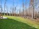 Spacious backyard with a fire pit area and green lawn, perfect for entertaining at 2127 Nims Village Dr, Fort Mill, SC 29715