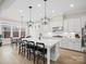 Modern kitchen featuring a large island with bar seating, stainless steel appliances, and ample counter space at 2127 Nims Village Dr, Fort Mill, SC 29715