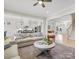 Spacious living room with modern decor, hardwood floors, and open layout to the kitchen at 2127 Nims Village Dr, Fort Mill, SC 29715