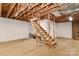 Unfinished basement boasts exposed ceiling and potential living space at 2274 Old Wilkesboro Rd, Statesville, NC 28625