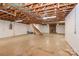 Large unfinished basement with exposed ceiling and brick fireplace at 2274 Old Wilkesboro Rd, Statesville, NC 28625