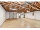 Large unfinished basement with garage door and utility connections at 2274 Old Wilkesboro Rd, Statesville, NC 28625